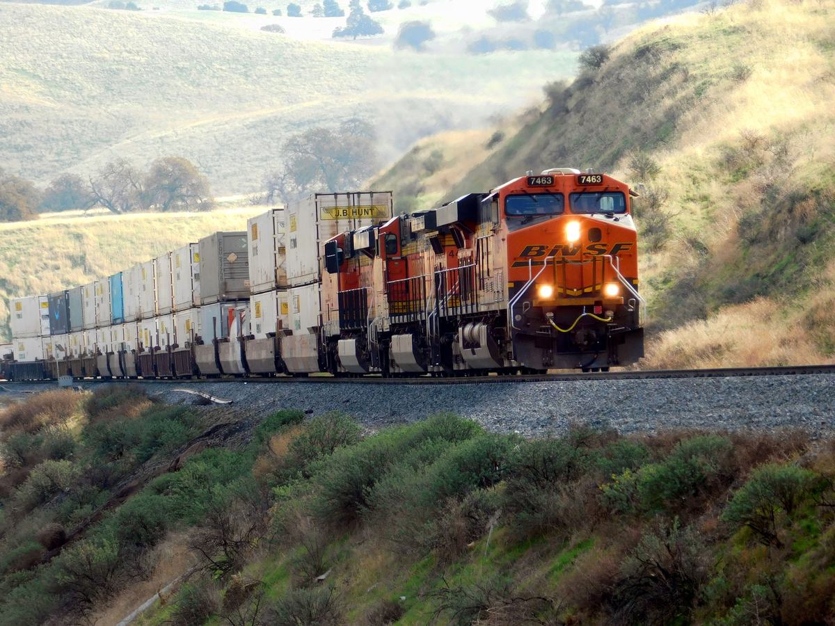 Intermodal freight train hauling containers through the countryside